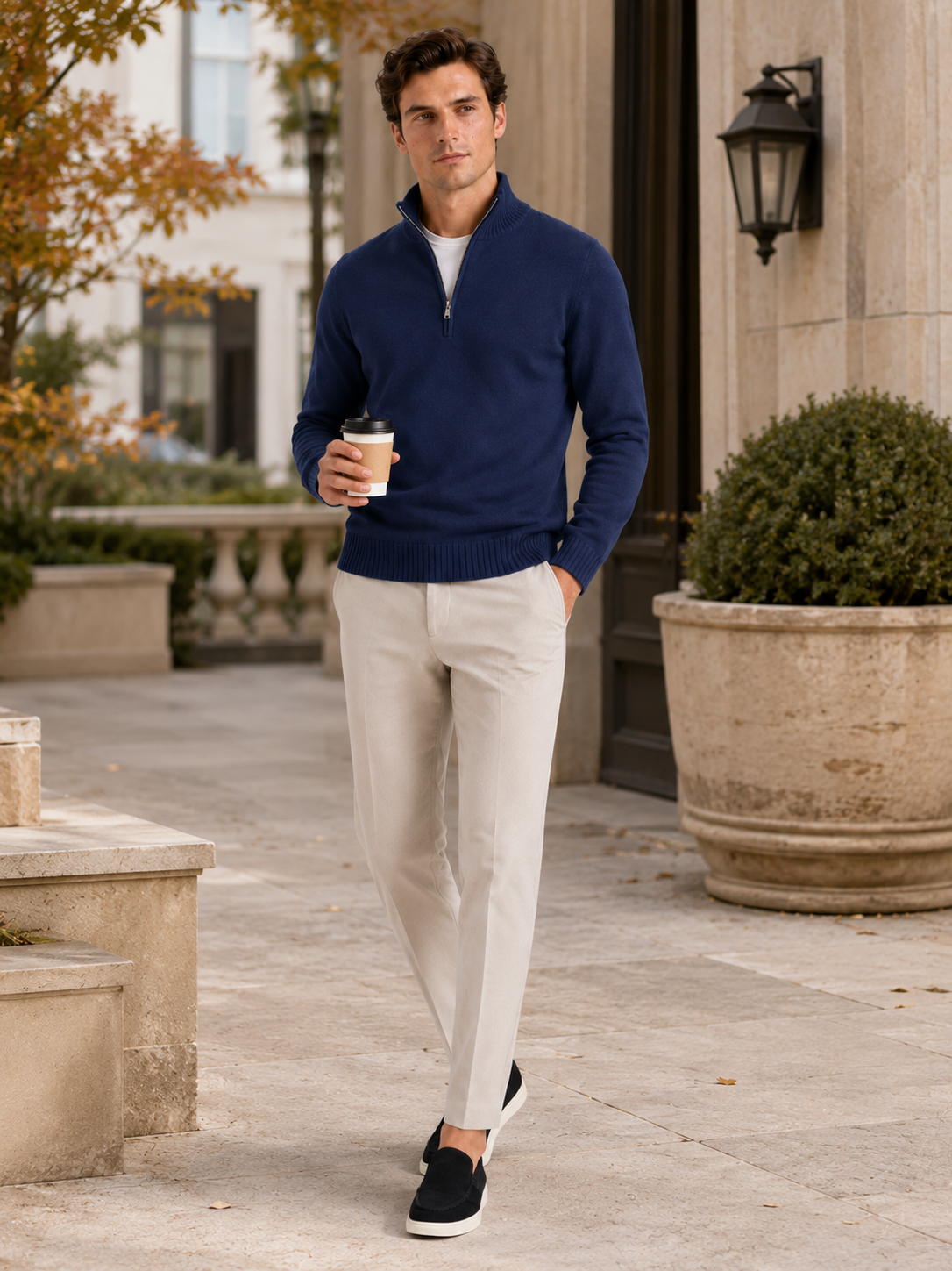 Man styling navy half zip sweater in a refined fall lifestyle outfit
