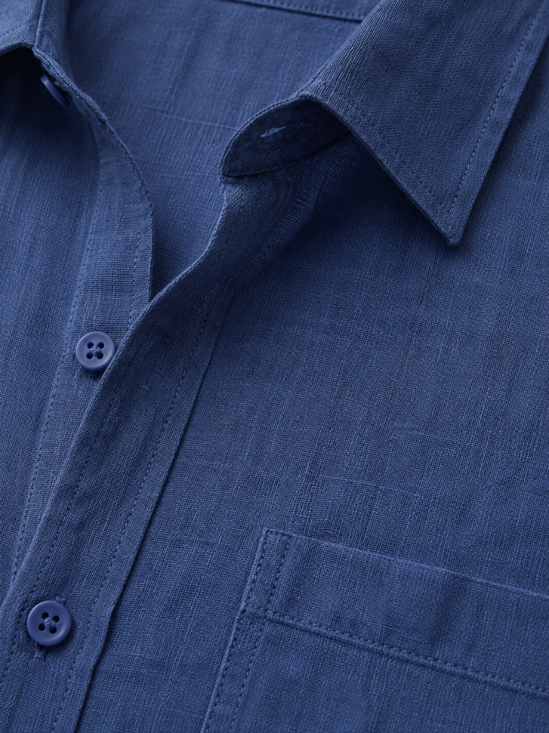 Close up of navy linen shirt fabric showing soft breathable natural woven texture