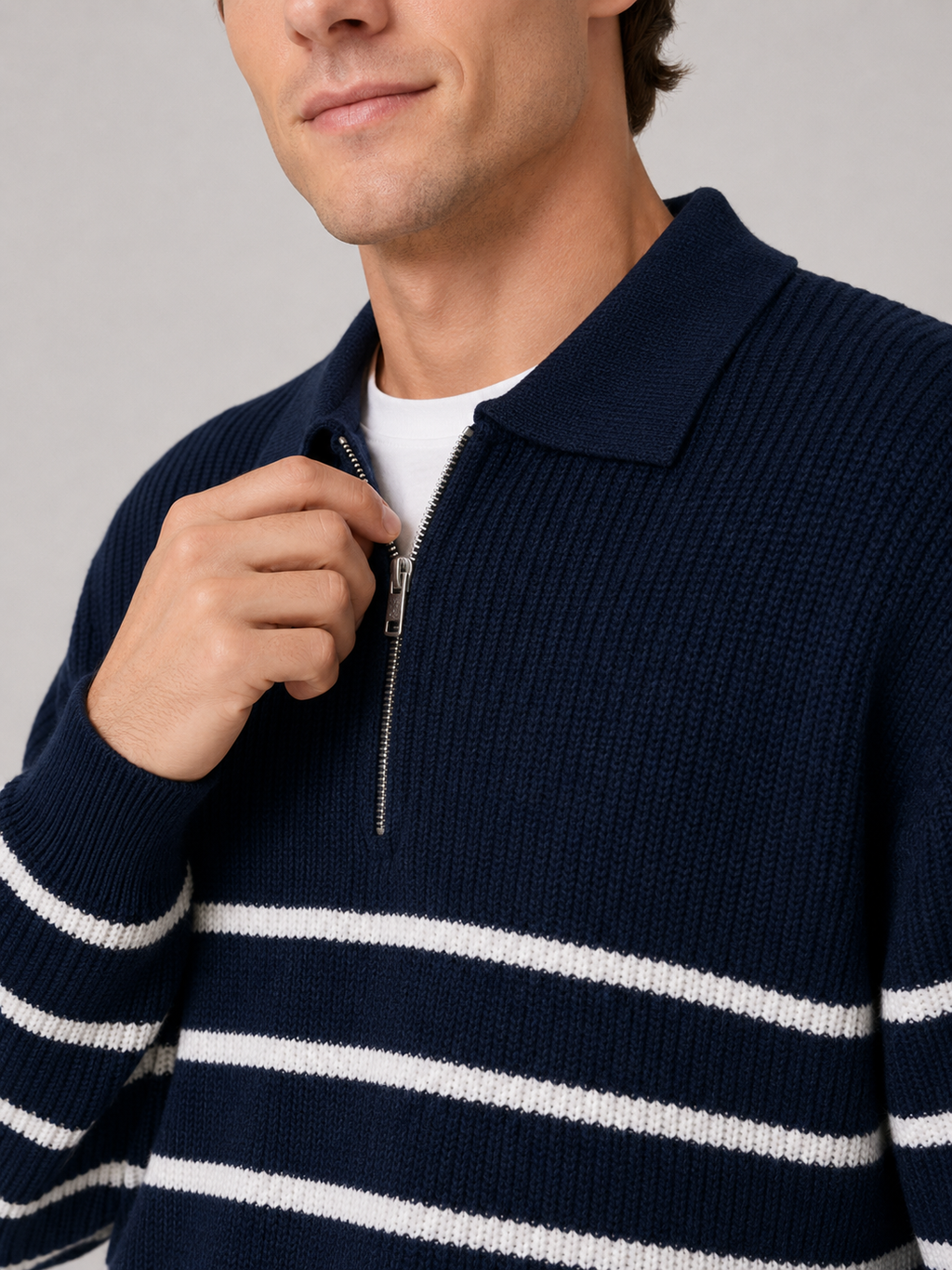 Close up of navy striped quarter zip sweater showing soft knit texture and zipper collar detail