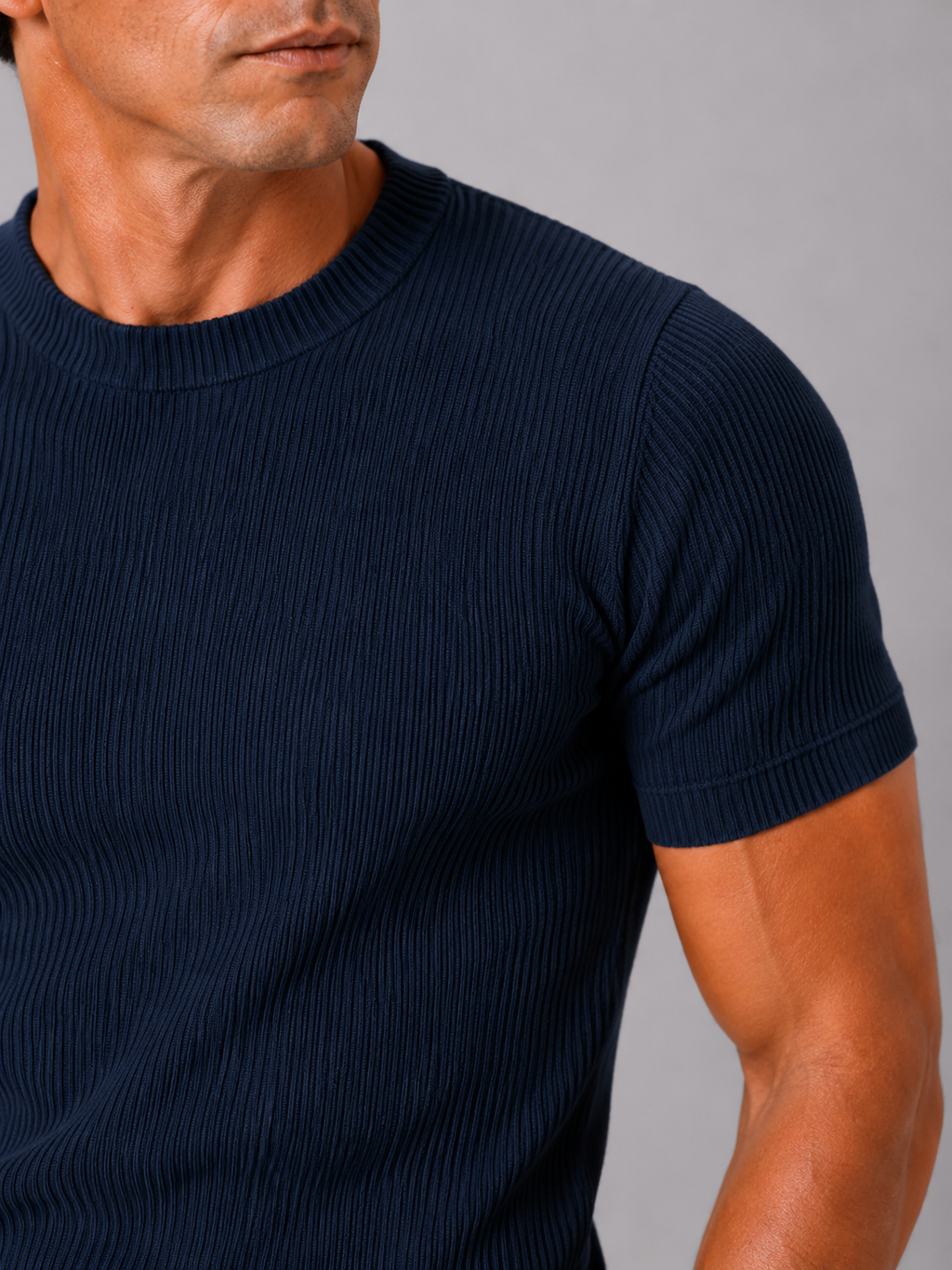 Close up of navy ribbed t shirt showing soft stretch fabric and textured crew neck detail