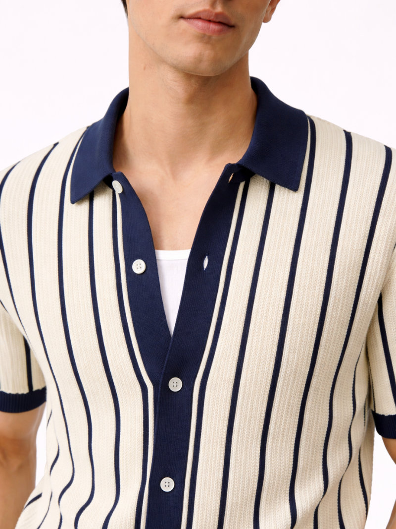 Cream and navy striped men’s short sleeve knitted polo shirt with soft texture and button closure, shown on model