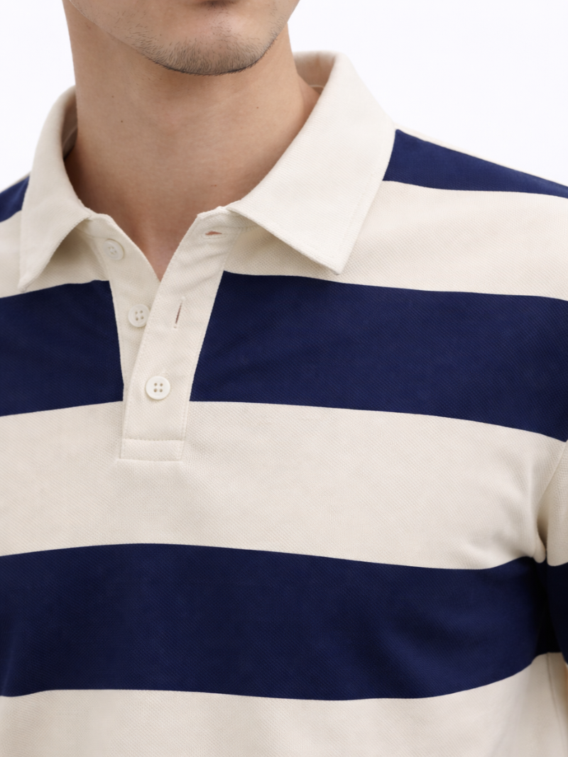 Close-up of men’s navy and white striped long sleeve rugby polo shirt worn by model