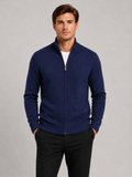 Front view of a man wearing a navy full zip knit sweater with a stand collar, slim fit, long sleeves, and warm fall winter design