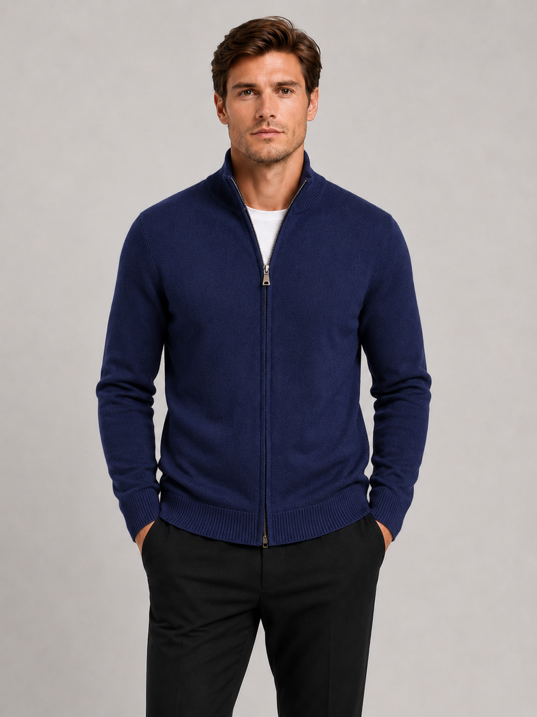 Front view of a man wearing a navy full zip knit sweater with a stand collar, slim fit, long sleeves, and warm fall winter design