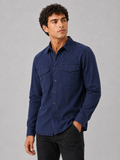 Men wearing navy cotton washed work shirt long sleeve double pocket casual button up style