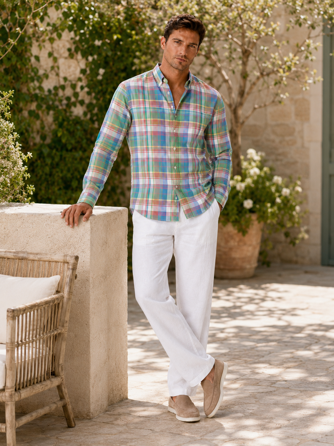 Man styling pink madras button up shirt in a clean spring everyday lifestyle outfit