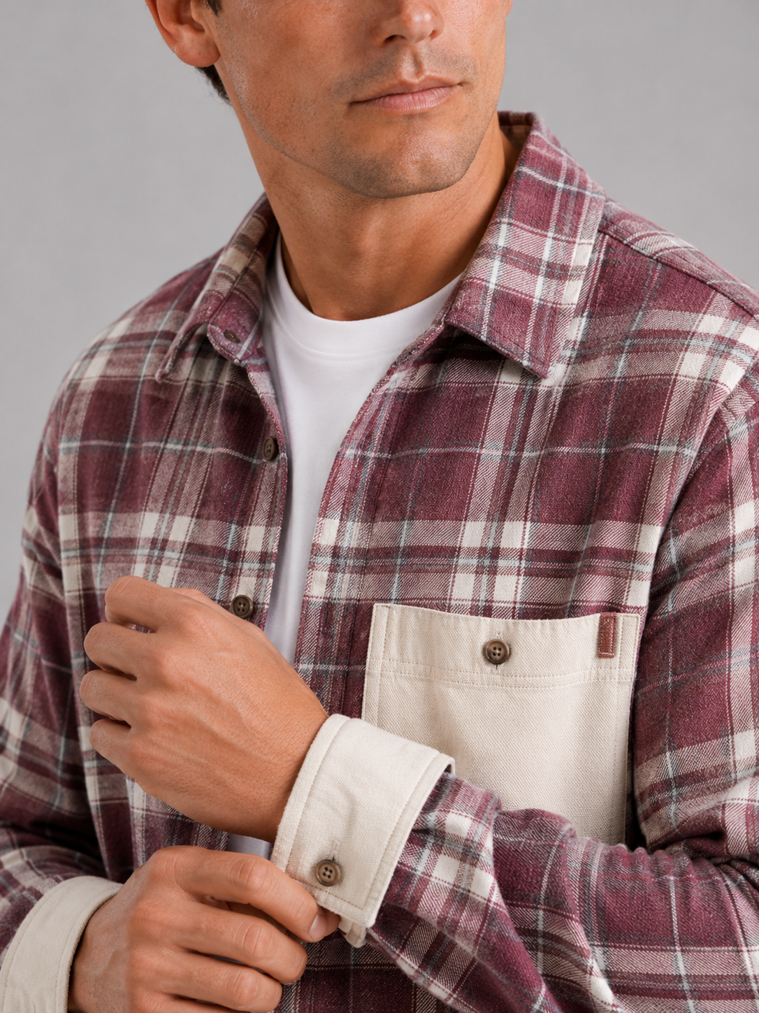 Close up of pink plaid flannel shacket showing soft brushed fabric and chest pocket detail