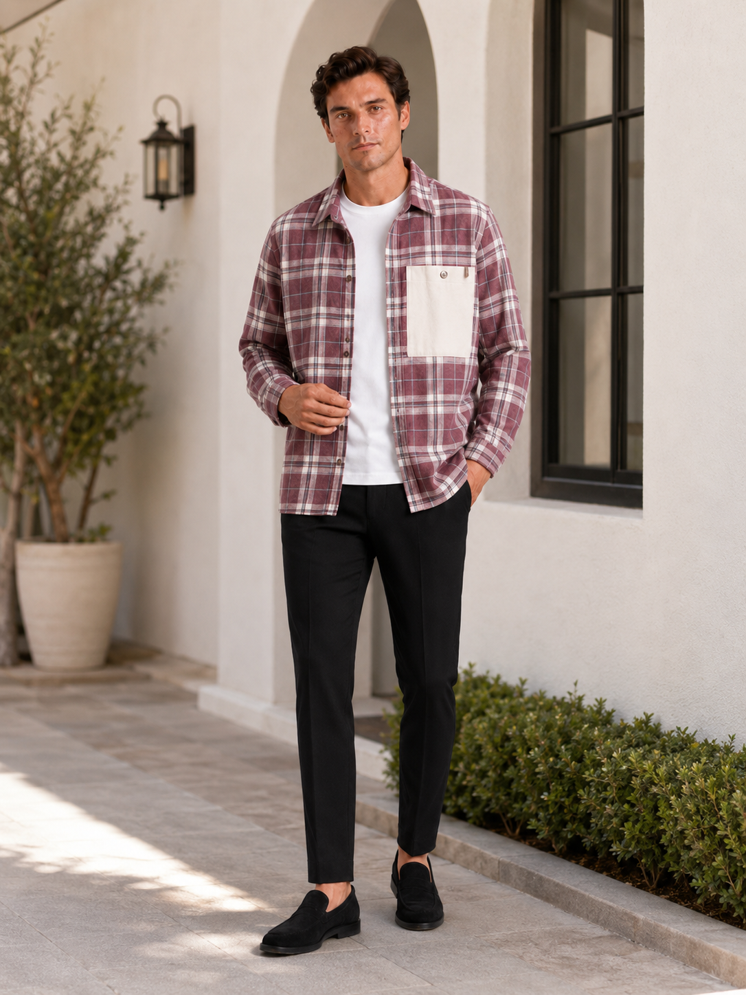 Man styling pink plaid flannel shirt jacket in a relaxed outdoor and streetwear lifestyle outfit