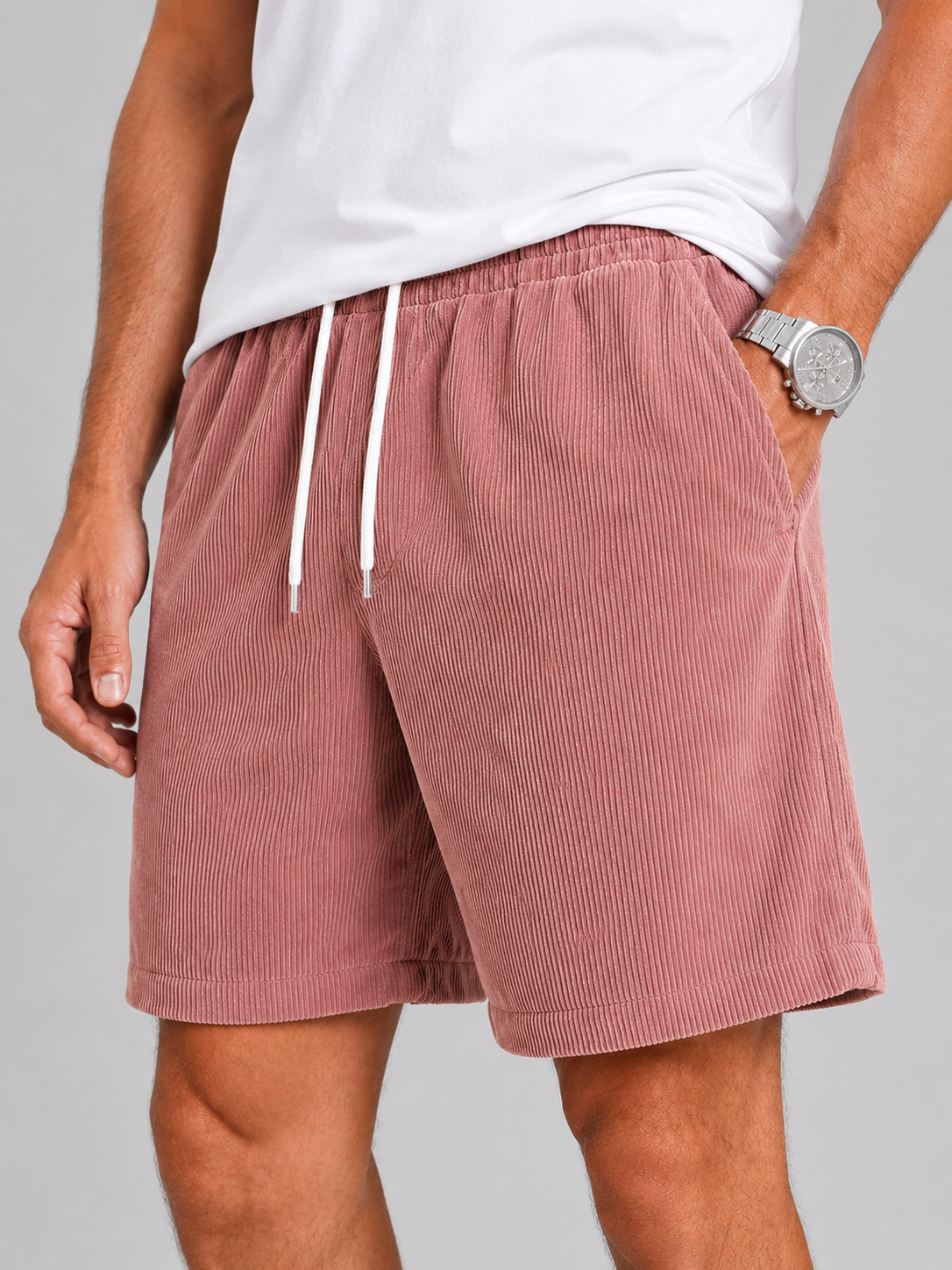 Close up of pink corduroy shorts showing soft textured fabric and adjustable drawstring waistband