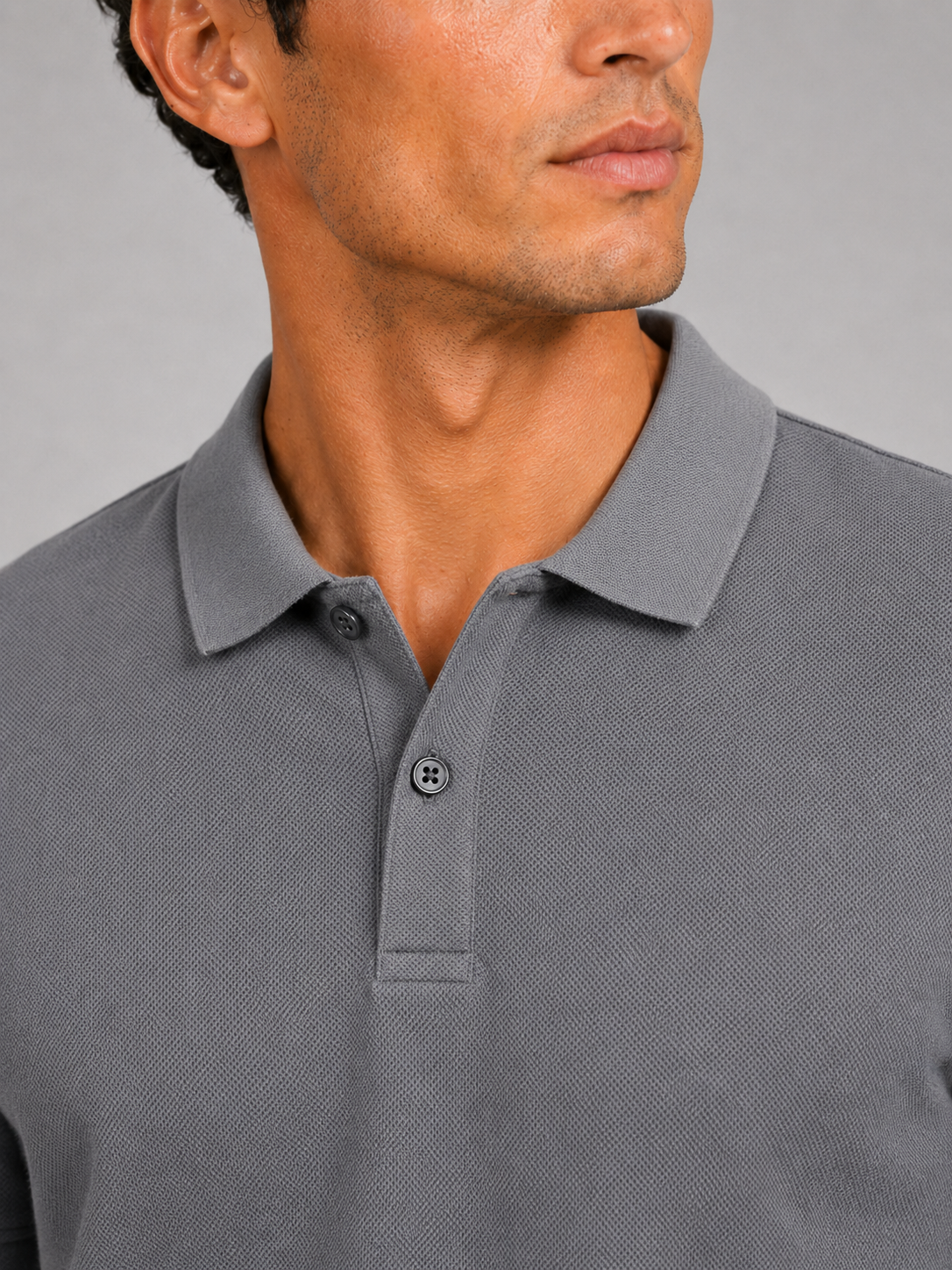 Close up of gray polo shirt showing smooth silk touch fabric and refined collar detail