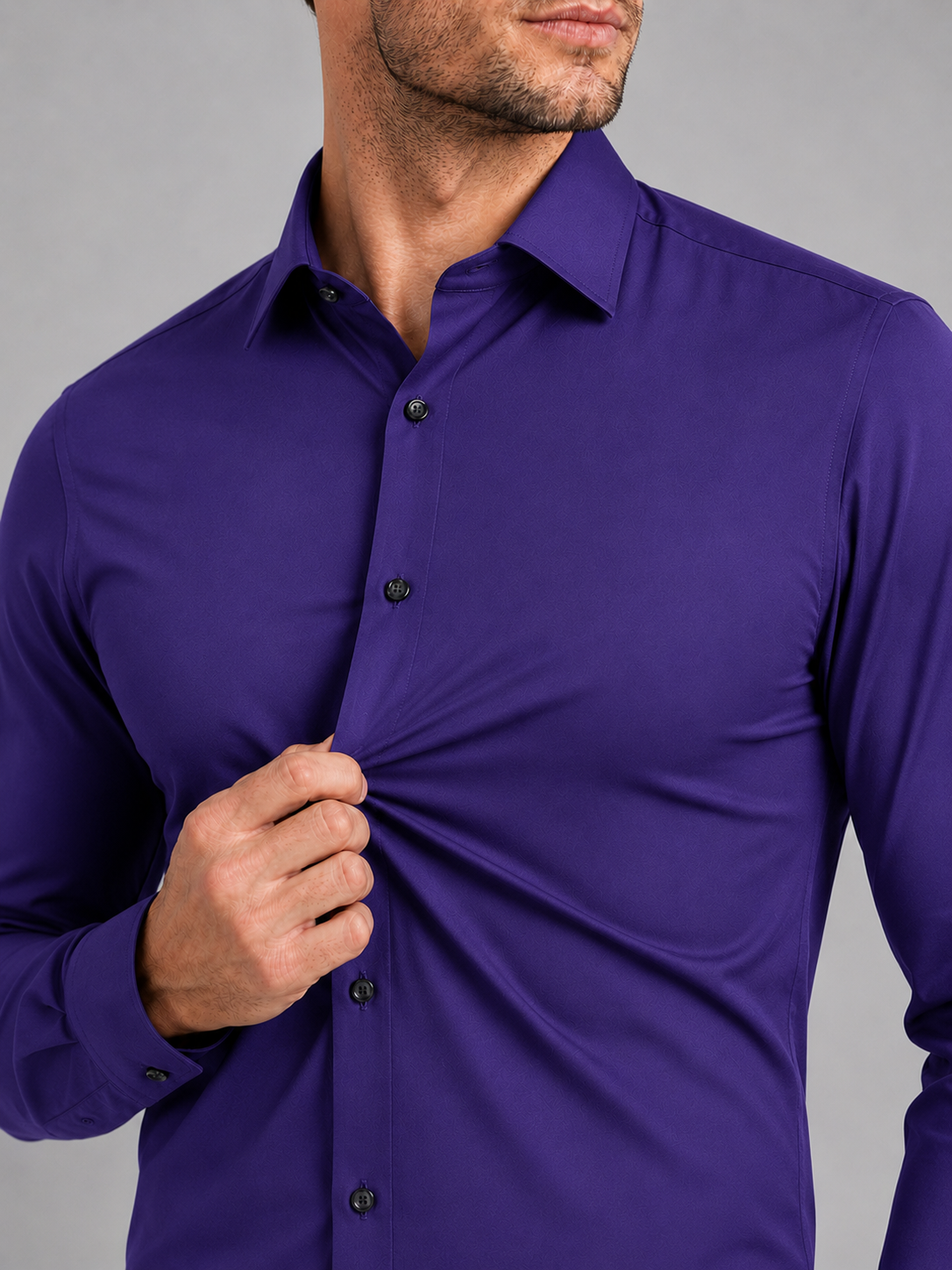 Close up of purple dress shirt showing wrinkle resistant stretch fabric and crisp collar detail