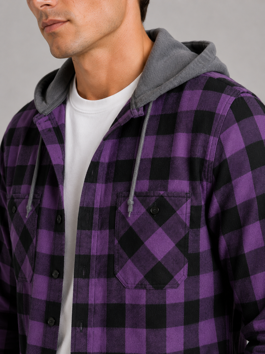 Close up of purple plaid flannel jacket showing soft brushed fabric and hood detail