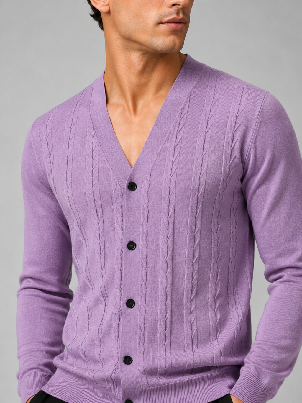 Close up of purple knit cardigan showing soft lightweight texture and refined button front detail