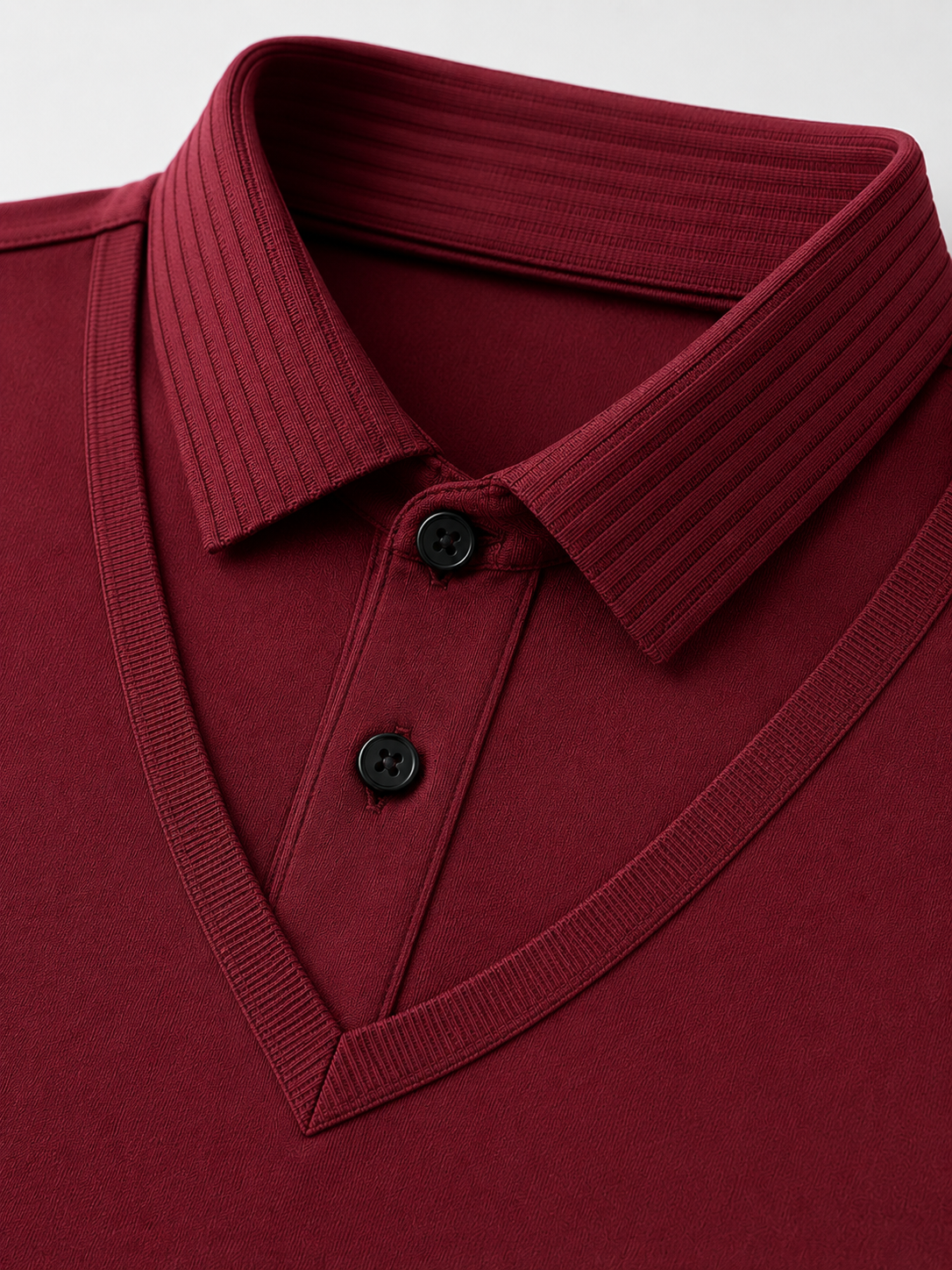Close up of red polo shirt showing soft lightweight fabric and refined collar detail