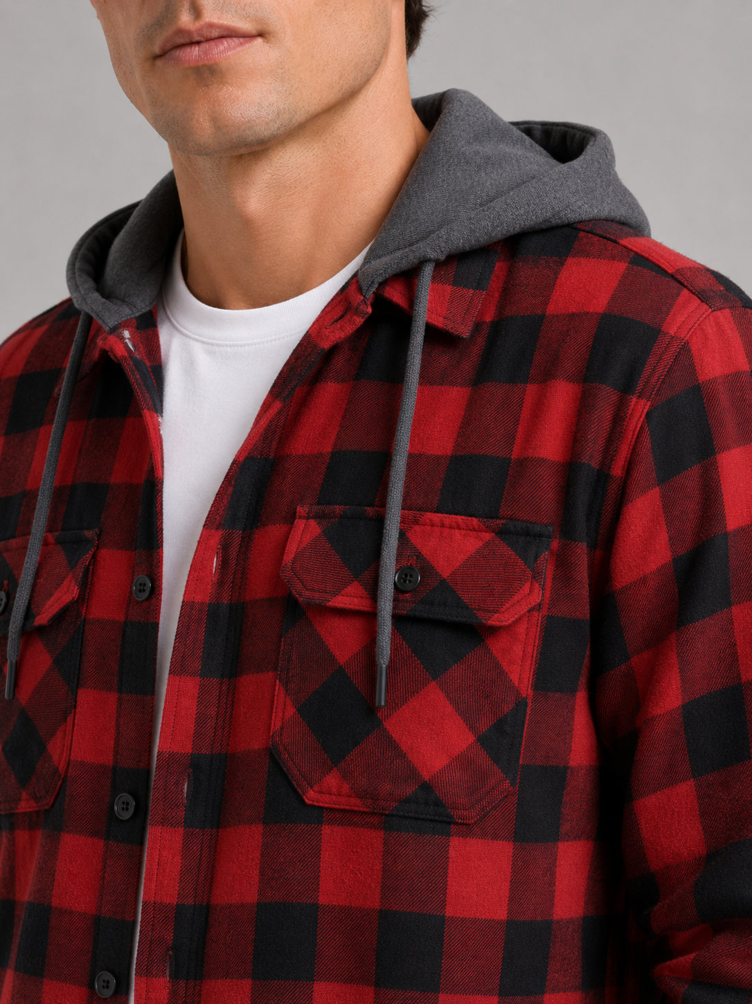 Close up of red plaid flannel jacket showing soft brushed fabric and hood detail