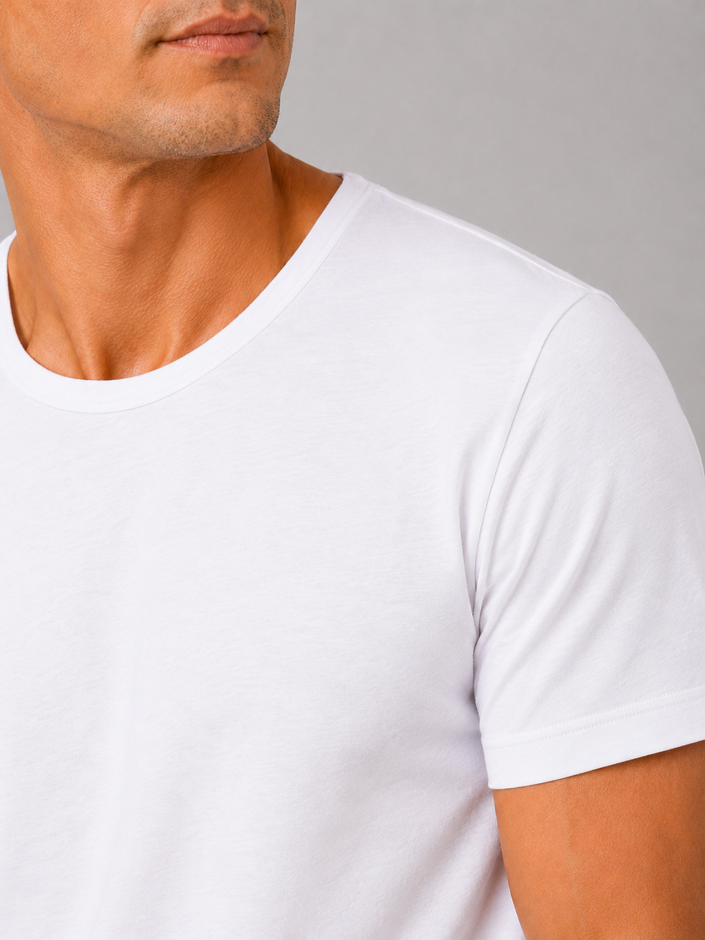 Close up of white cotton t shirt showing soft breathable fabric and clean crew neck detail