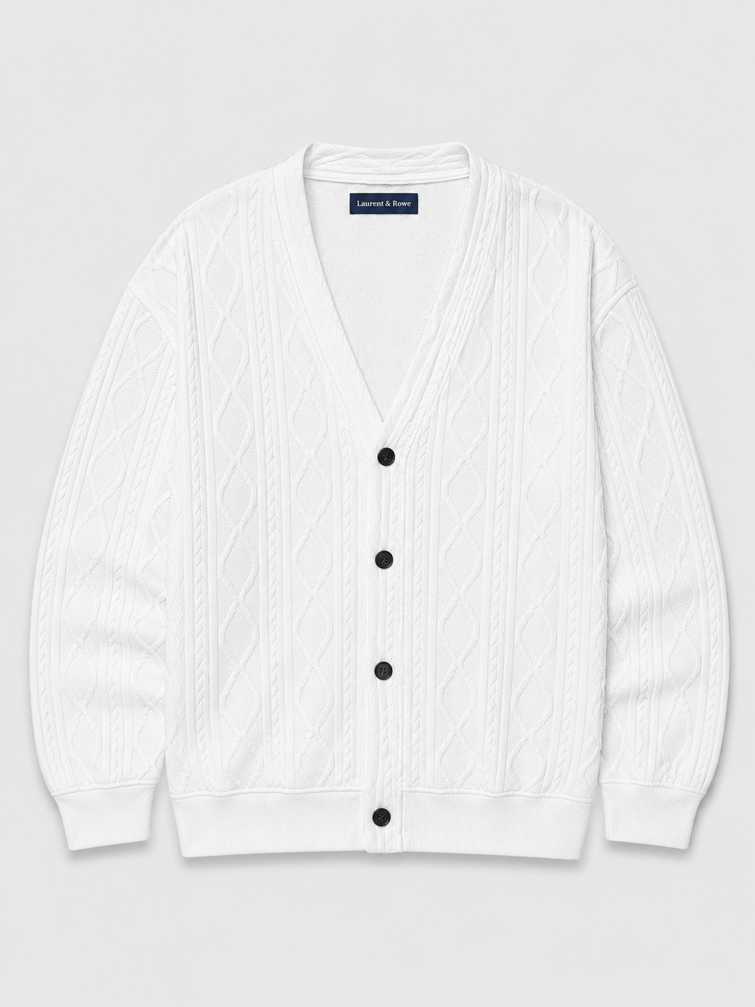 White men’s cable knit cardigan sweater with a V-neck, diamond pattern, and oversized silhouette displayed on a plain background