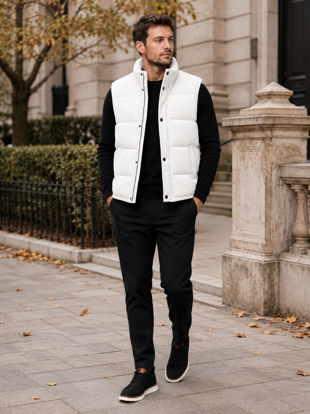 Man wearing a white corduroy puffer vest in a casual fall winter outfit for outdoor and everyday wear