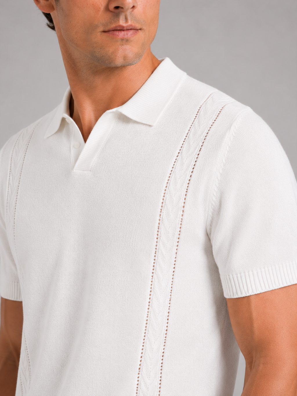 Close up of white knit polo shirt showing soft breathable fabric and refined collar detail