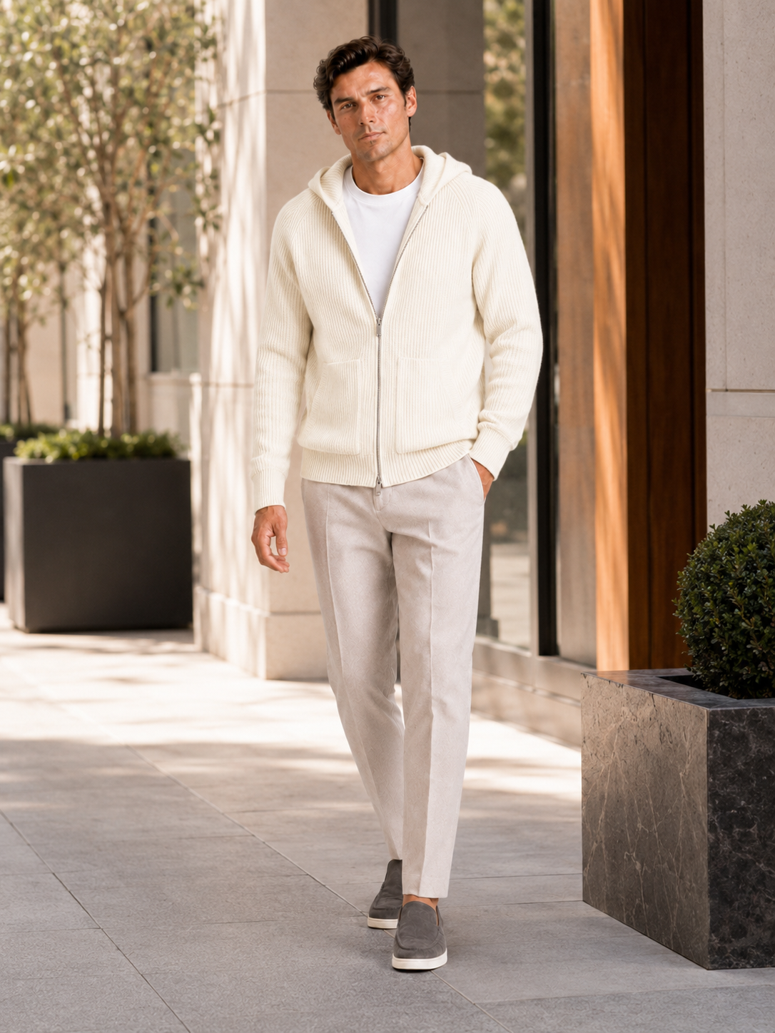 Man styling white merino wool zip hoodie cardigan in a minimal fall winter lifestyle outfit