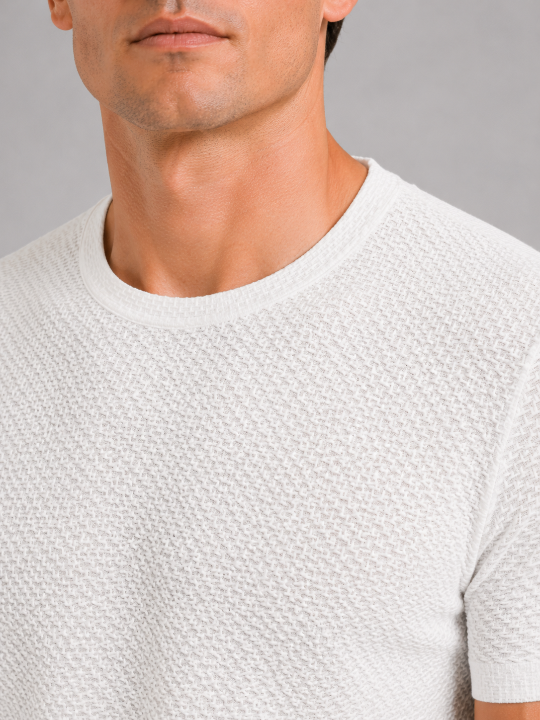 Close up of white mesh t shirt showing breathable texture and soft stretch fabric detail