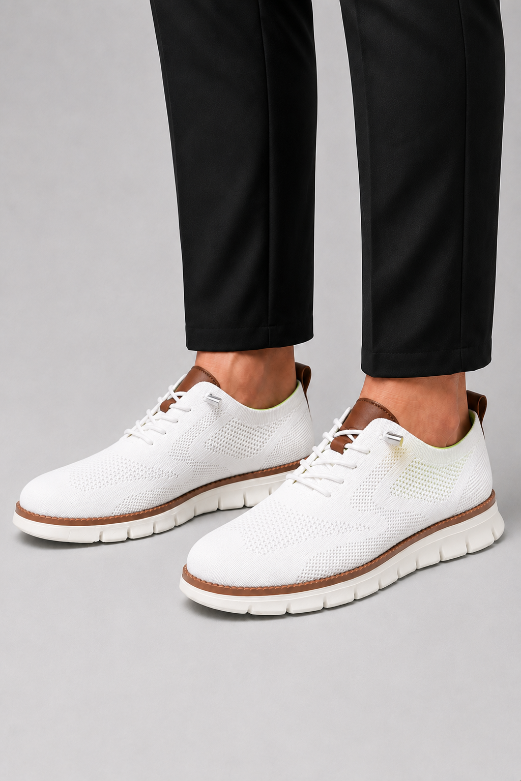 Man styling white mesh sneakers in a clean summer travel and everyday lifestyle outfit
