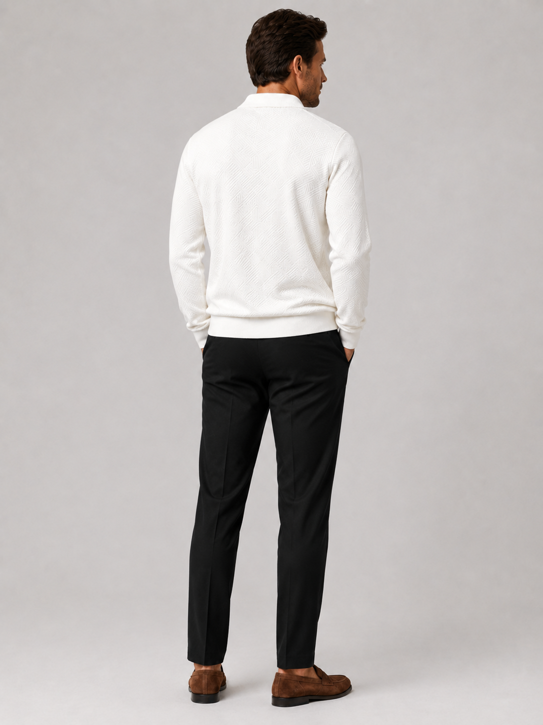 Back view of a man wearing a white quarter zip knit polo sweater showing the lightweight fabric and regular fit