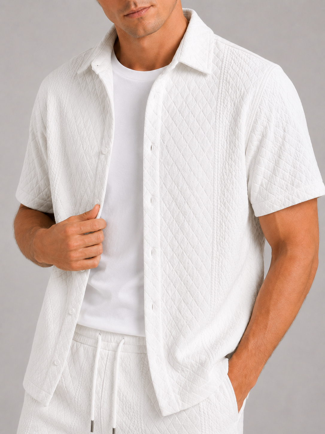 Close up of white textured two piece set showing lightweight fabric and woven texture detail