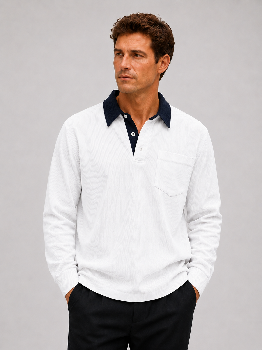 Front view of a man wearing a white corduroy long sleeve polo shirt with a contrast turn-down collar and relaxed fit