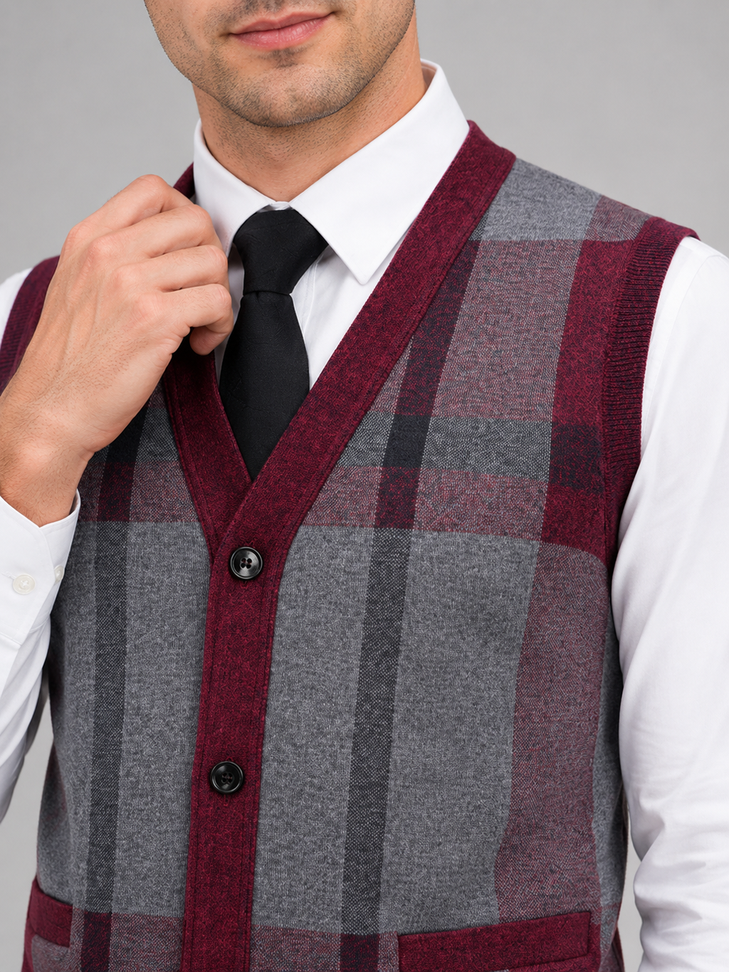 Close up of wine fleece sweater vest showing soft knit texture and button front detail