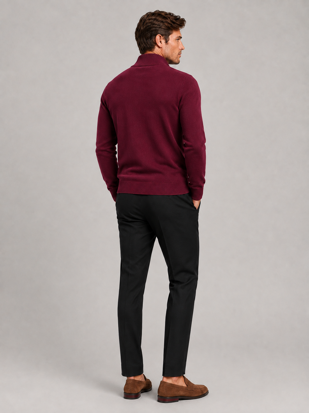 Back view of a man wearing a wine full zip knit sweater showing the slim fit, long sleeves, and clean knit construction