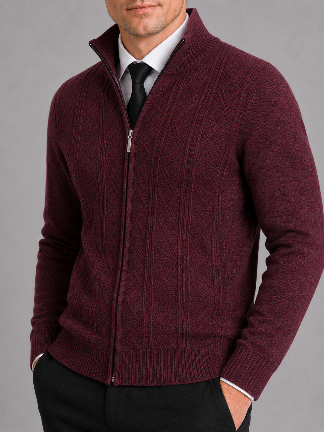 Close up of wine full zip sweater showing thick knit texture and stand collar detail