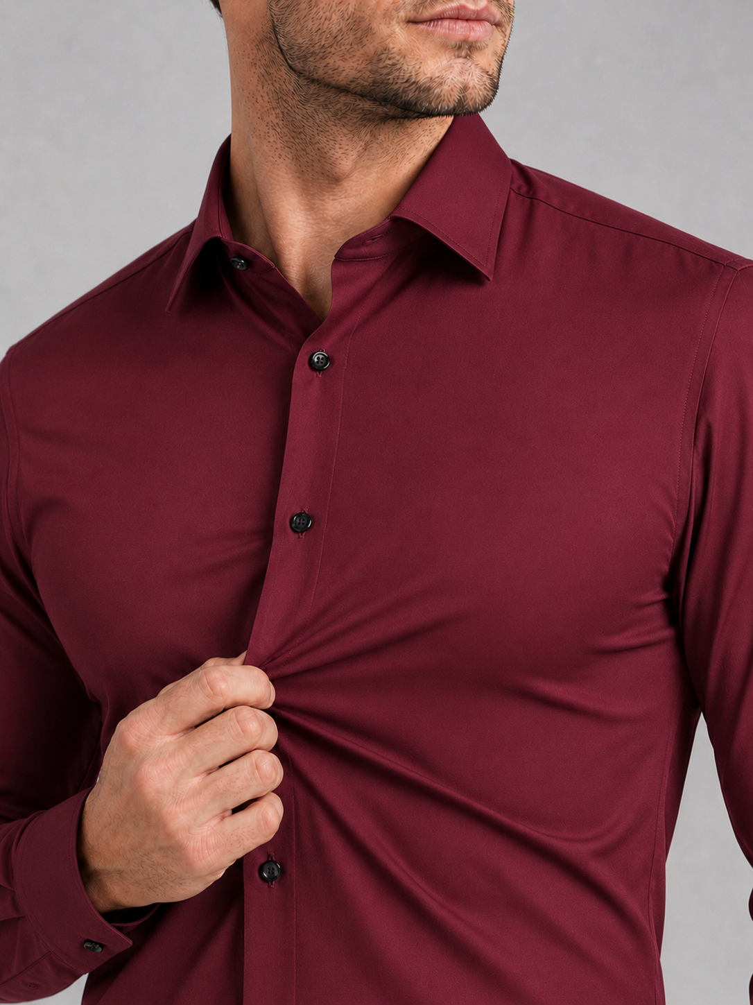 Close up of wine dress shirt showing wrinkle resistant stretch fabric and crisp collar detail