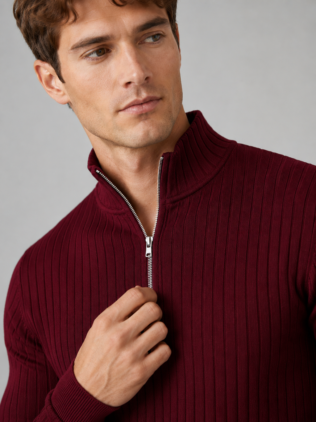 Close up of wine quarter zip sweater showing soft knit texture and mock neck zipper detail