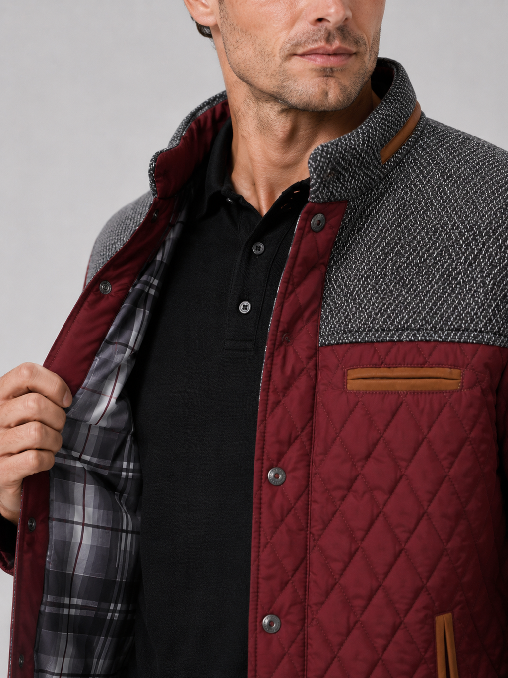 Close up of wine quilted jacket showing diamond stitching and button down front detail
