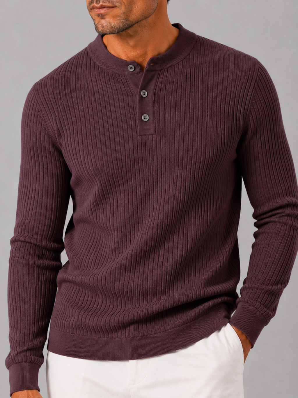Close up of wine ribbed henley polo showing striped knit texture and button detail