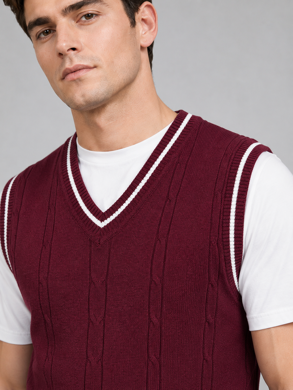 Close up of wine patchwork sweater vest showing soft knit texture and classic v neck detail