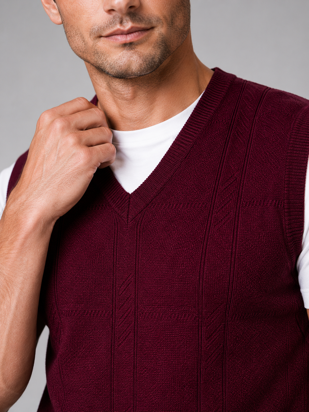 Close up of wine sweater vest showing soft knit texture and classic v neck detail