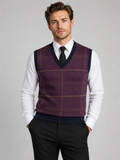 Front view of a man wearing a wine red V-neck sweater vest with a diamond cable knit pattern and warm pullover design