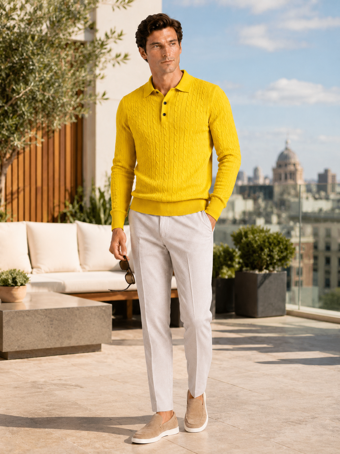 Man styling yellow cable knit long sleeve polo in a warm winter lifestyle outfit
