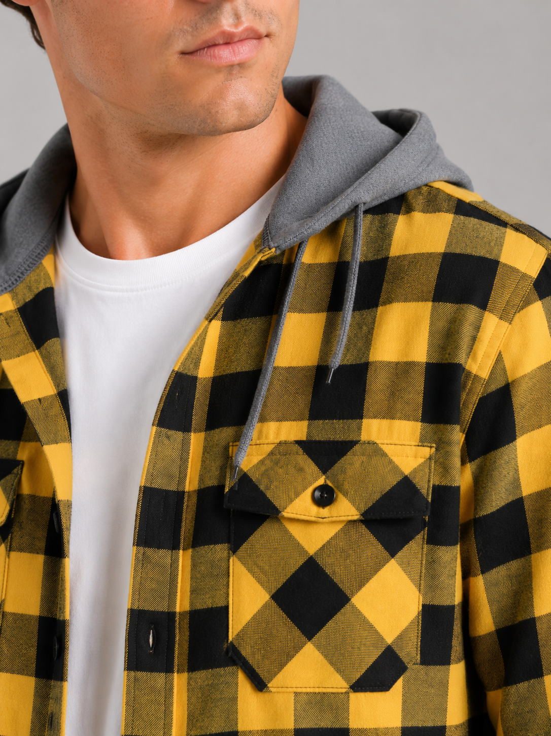 Close up of yellow plaid flannel jacket showing soft brushed fabric and hood detail