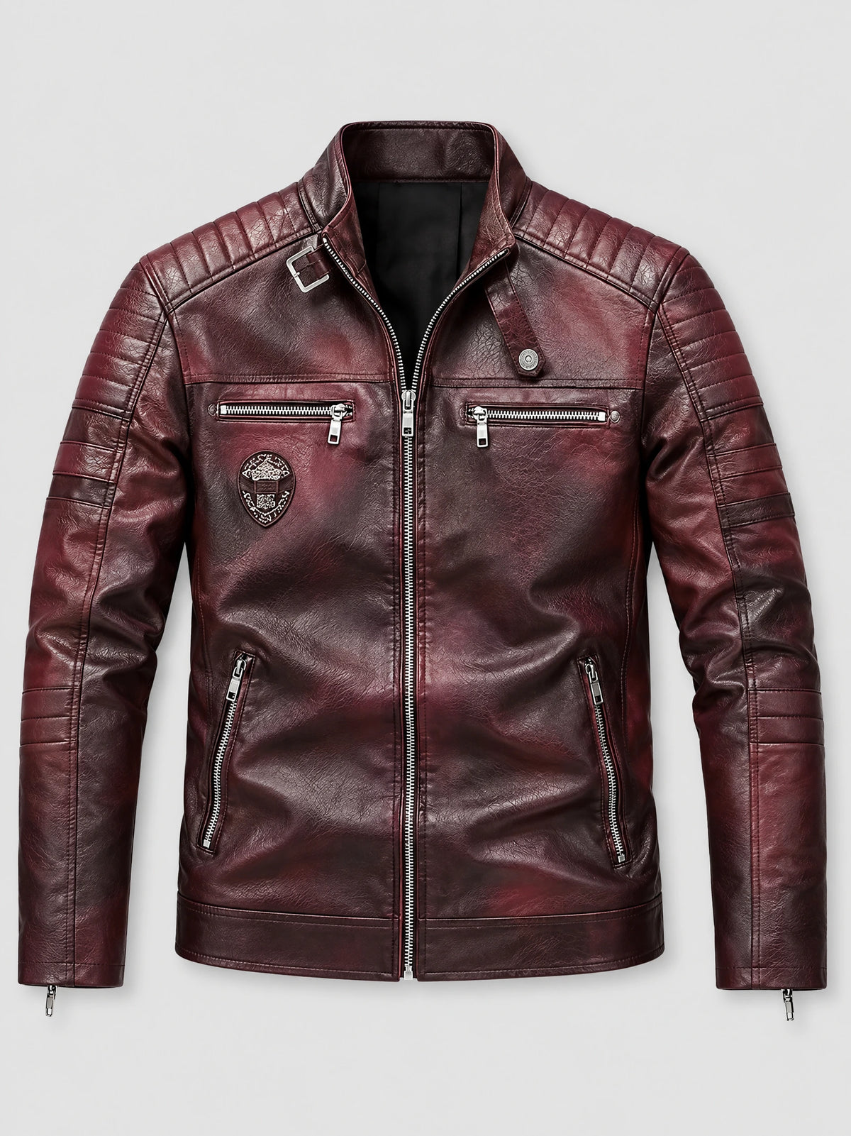 Red biker leather jacket laid flat, featuring a stand collar, quilted shoulder panels, and multiple zip pockets.