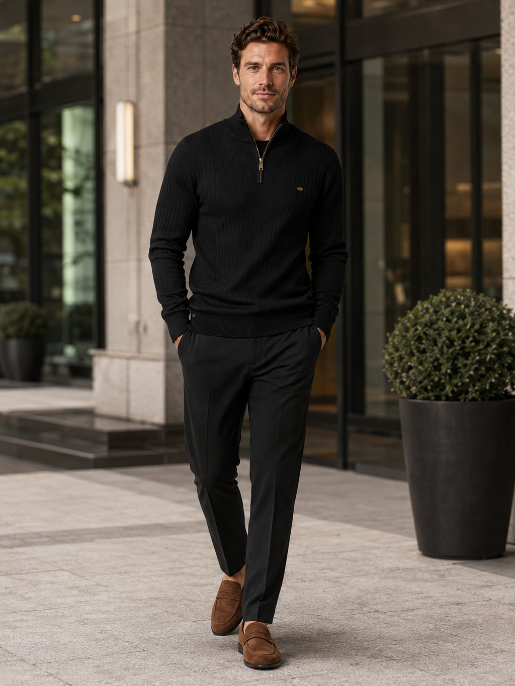 Man wearing a black quarter zip cotton knit sweater in a business casual fall winter outfit for everyday wear