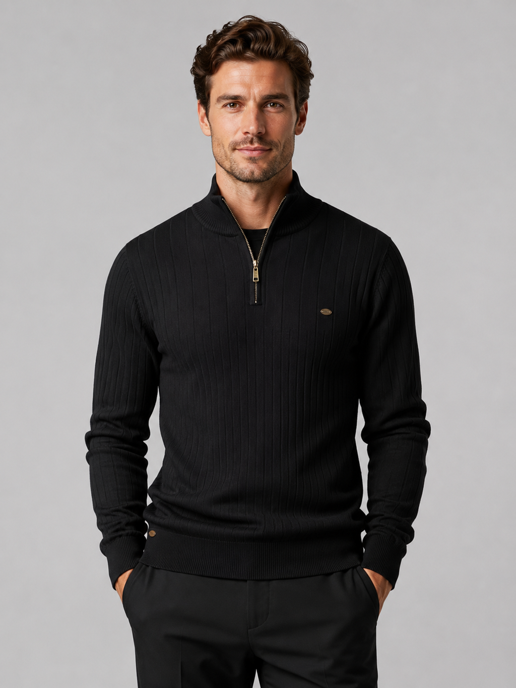 Front view of a man wearing a black quarter zip pullover sweater with a stand collar, warm cotton knit, and long sleeves