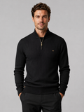 Front view of a man wearing a black quarter zip pullover sweater with a stand collar, warm cotton knit, and long sleeves
