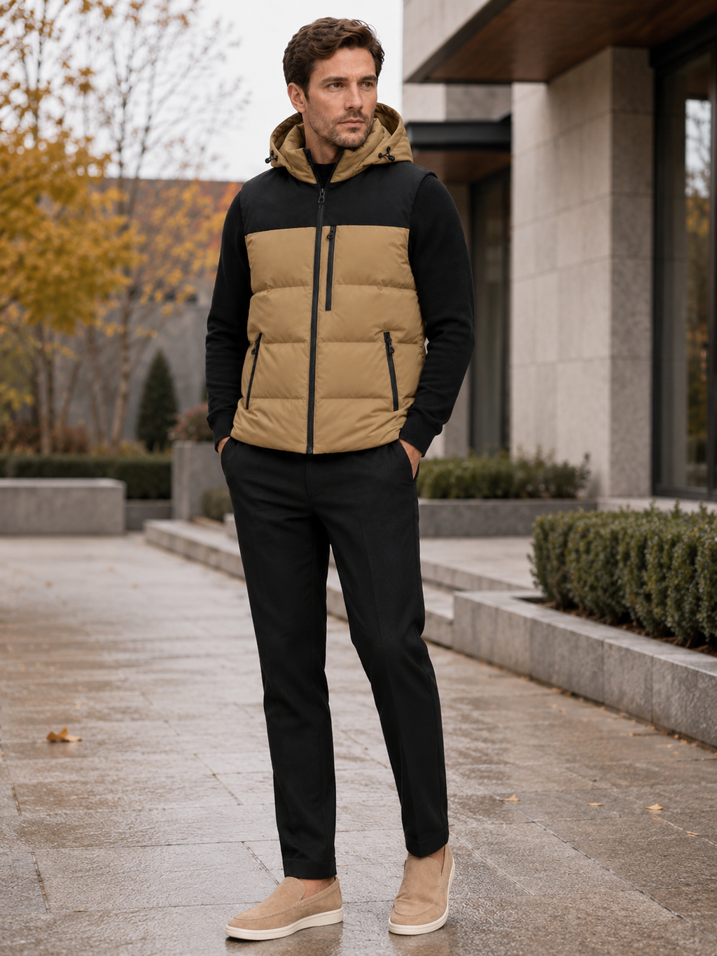 Man wearing a brown hooded puffer vest in a casual fall winter outfit for outdoor and everyday wear