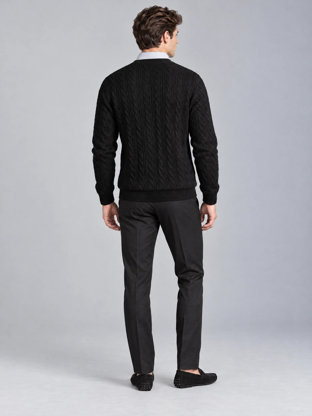 Rear studio view of a model wearing the Black Business Casual Knitted Pullover Sweater with cable-knit texture and ribbed trim.