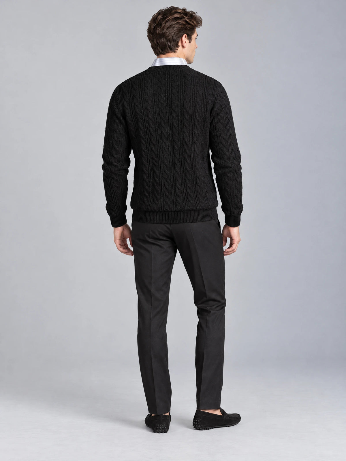Rear studio view of a model wearing the Black Business Casual Knitted Pullover Sweater with cable-knit texture and ribbed trim.