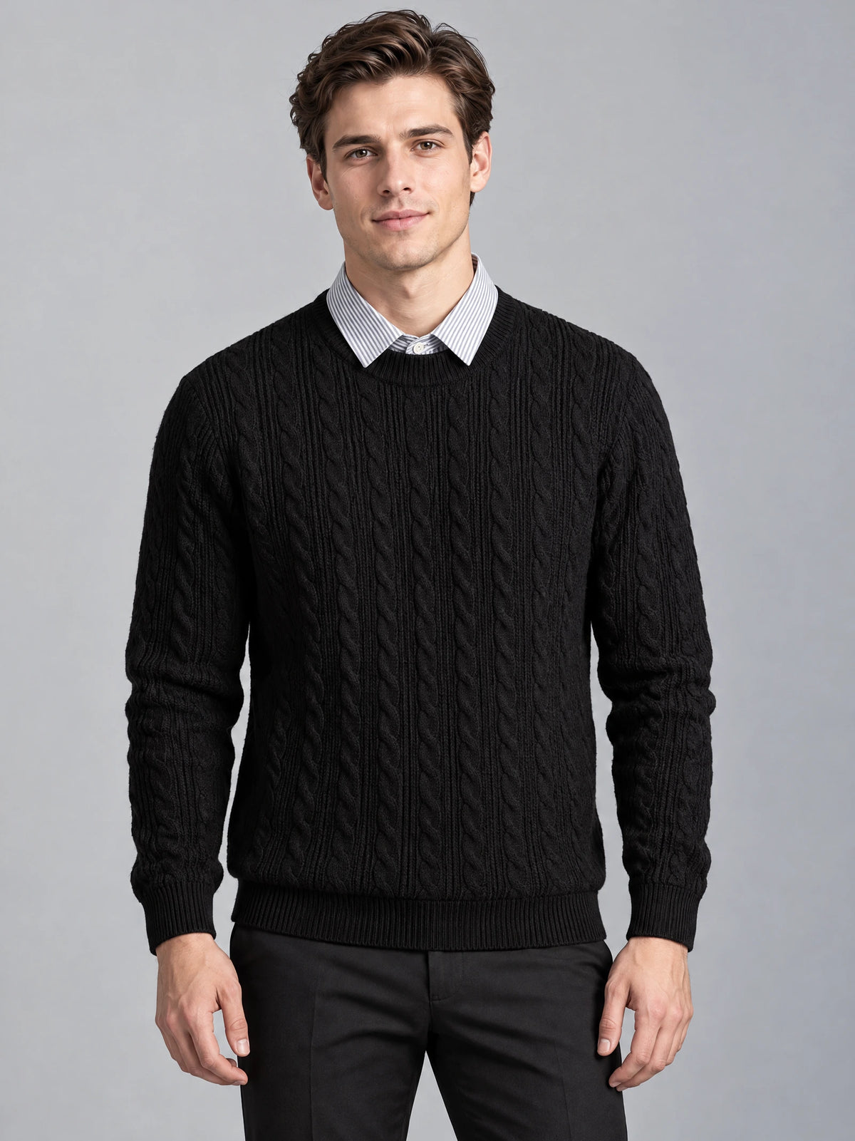 Front studio view of a model wearing a Black business casual knitted pullover sweater with cable knit texture and a faux shirt collar.