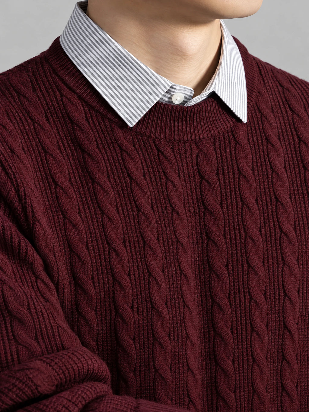 Close-up of the Wine business casual knitted pullover sweater with cable-knit texture and faux striped shirt collar.